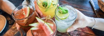 Friends,Toasting,,Saying,Cheers,Holding,Tropical,Blended,Fruit,Margaritas.,Watermelon