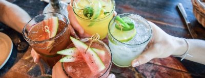 Friends,Toasting,,Saying,Cheers,Holding,Tropical,Blended,Fruit,Margaritas.,Watermelon